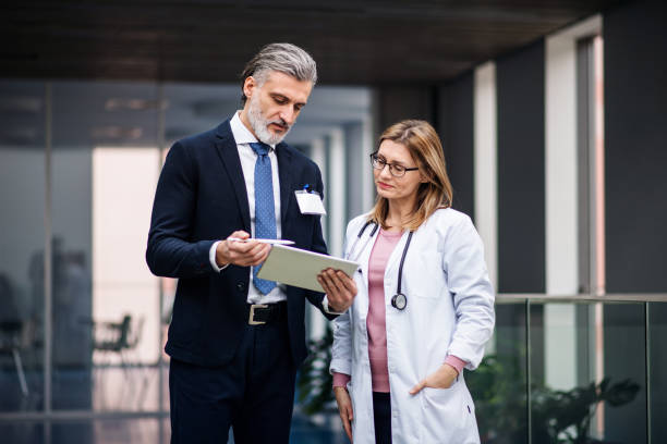 Professionals reviewing documents in a healthcare setting